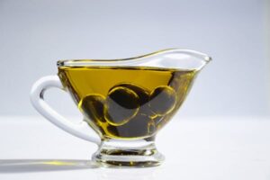 Is olive oil a suitable and sustainable option for aquaculture feed enrichment?